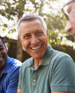 Group of men laughing together outdoors