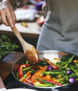 Person making a vegetable stir fry