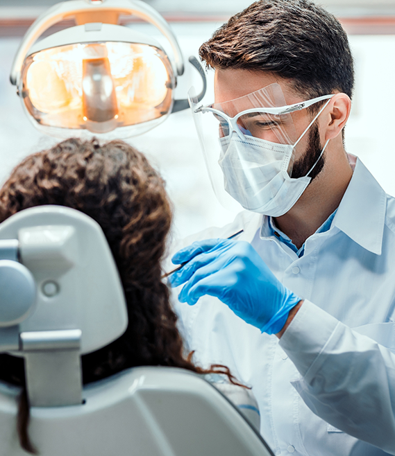 Dentist giving a patient a dental exam